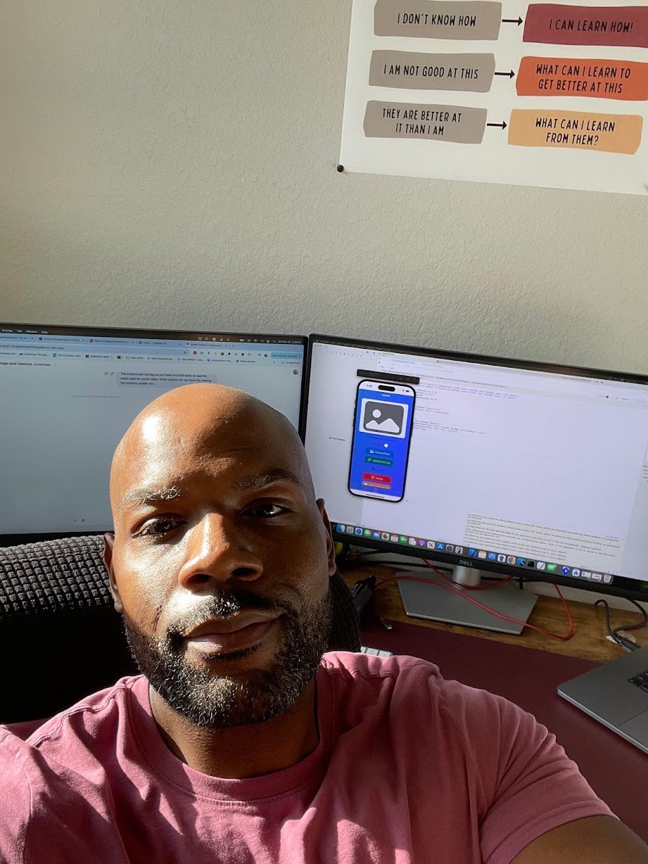 Moses Smith, founder of Everyday AI, at his desk with dual monitors and growth mindset poster