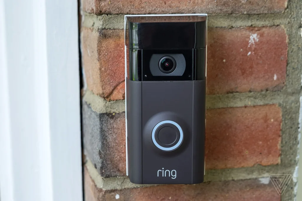 Smart doorbell mounted on brick wall