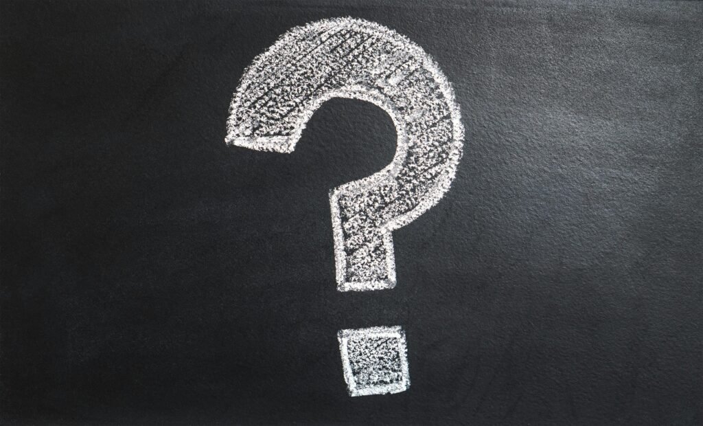 Question mark on chalkboard representing AI journal prompts for self-reflection