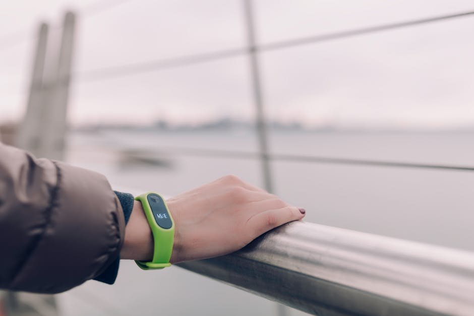Woman wearing AI mental health wearable smartwatch in urban setting