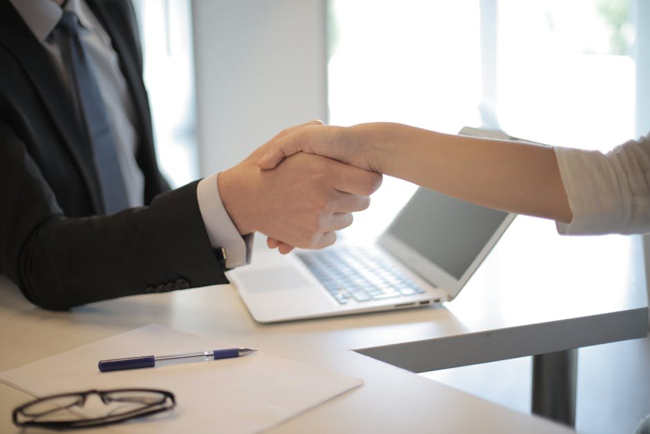 Professional handshake after successful AI salary negotiation