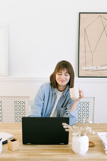 Person enjoying coffee while using laptop for writing, representing relaxed AI-assisted workflow