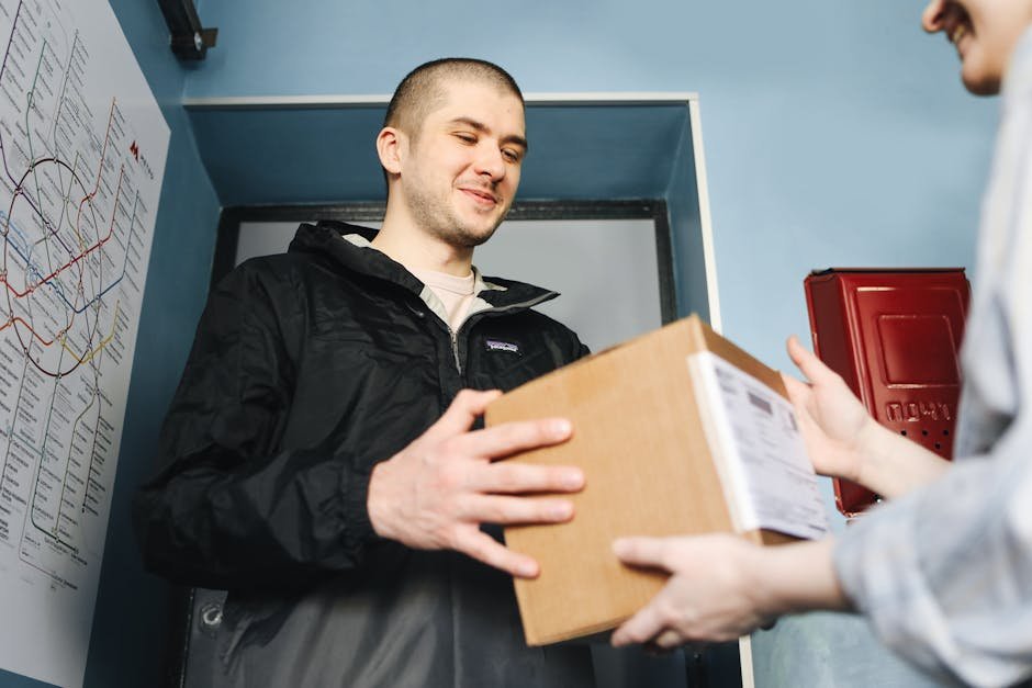 Woman receiving package delivery at home