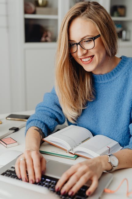 Woman productively working with laptop and book using AI content summarizer tools