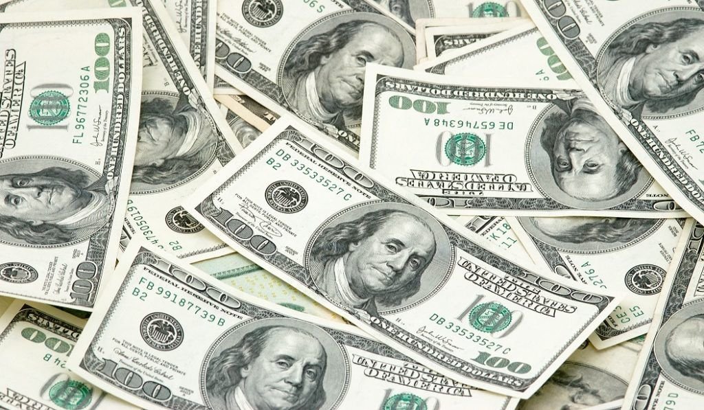 Stacks of money representing billions flowing into AI startup funding