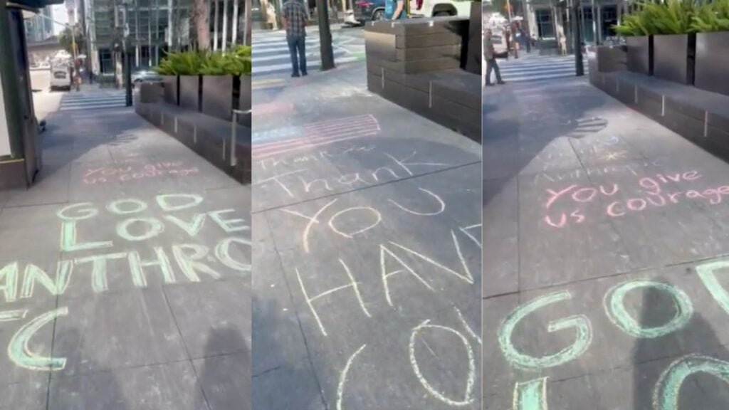 Chalk art outside Anthropic offices in San Francisco reading you give us courage after Pentagon ban