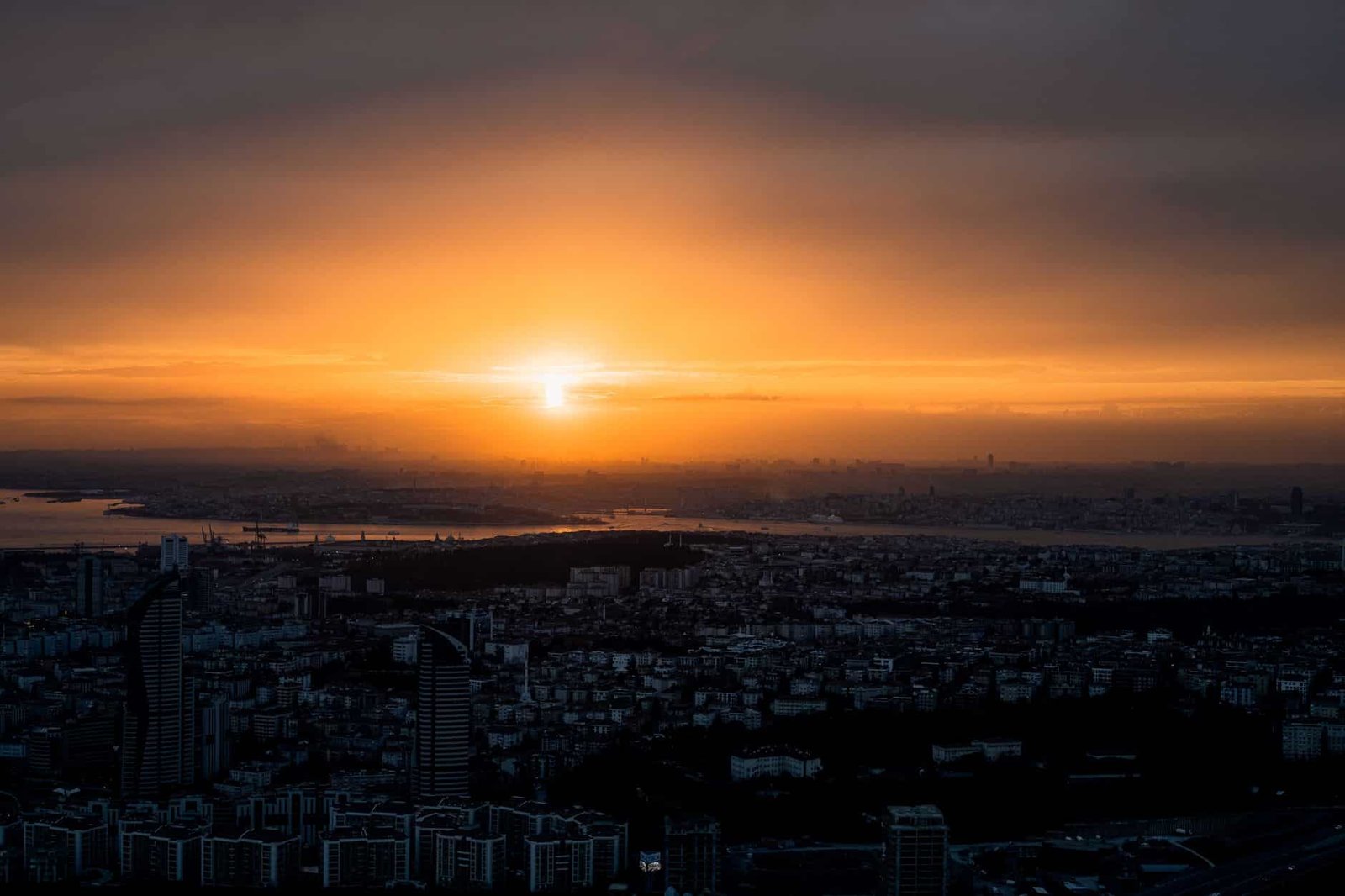 Golden sunrise over a city skyline, a nod to OpenAI naming its new flagship model Sol