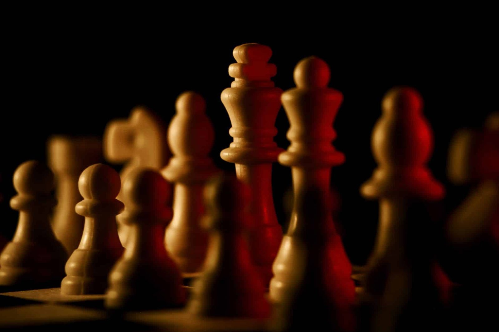 GPT-5.6 Sol vs Claude Fable 5 face-off shown as dramatically lit chess pieces on a dark board