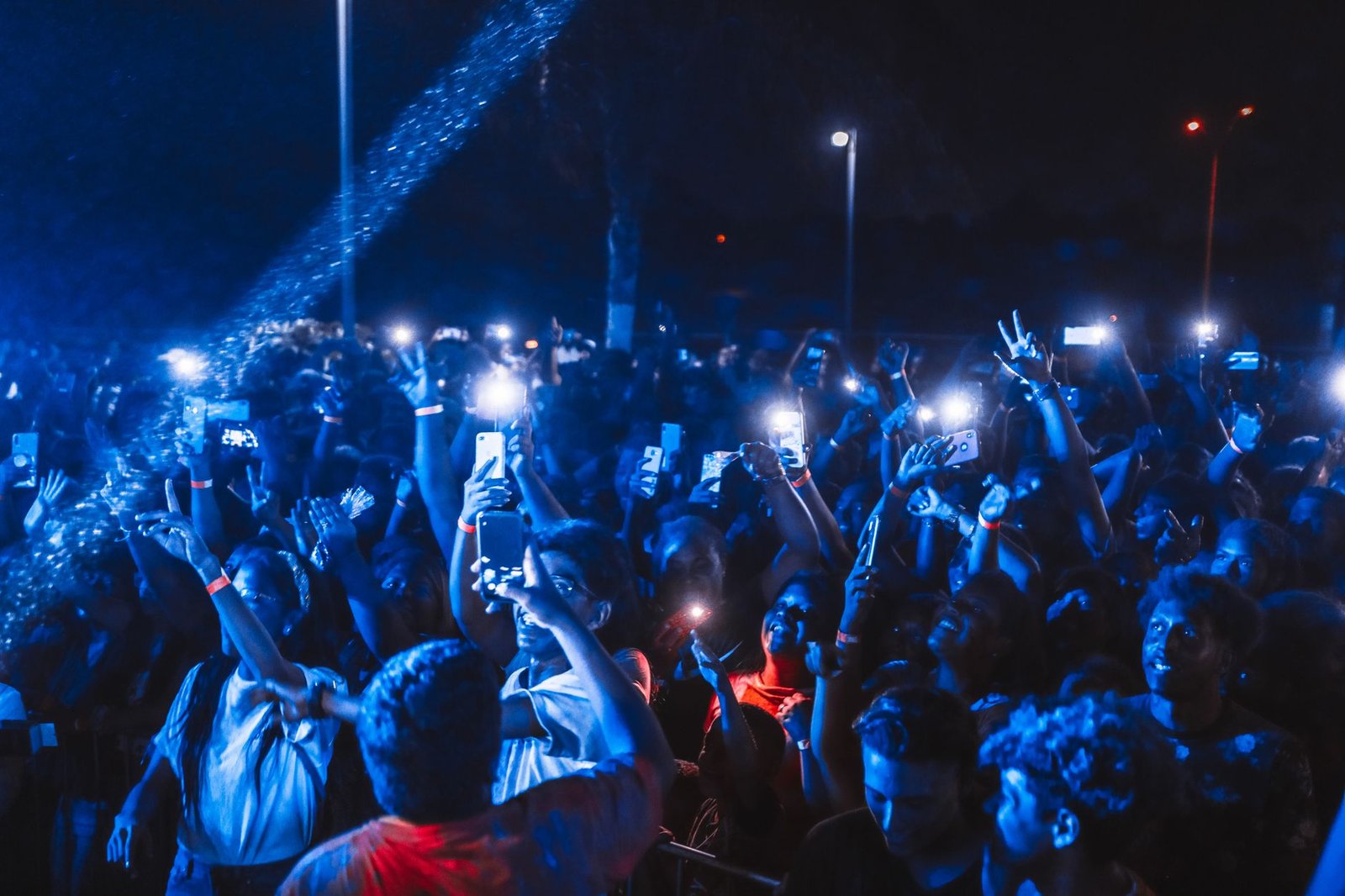 Meta Killed the Instagram AI Photo Feature. The Backlash Actually Worked. 1 Crowd at a nighttime event holding up glowing phones