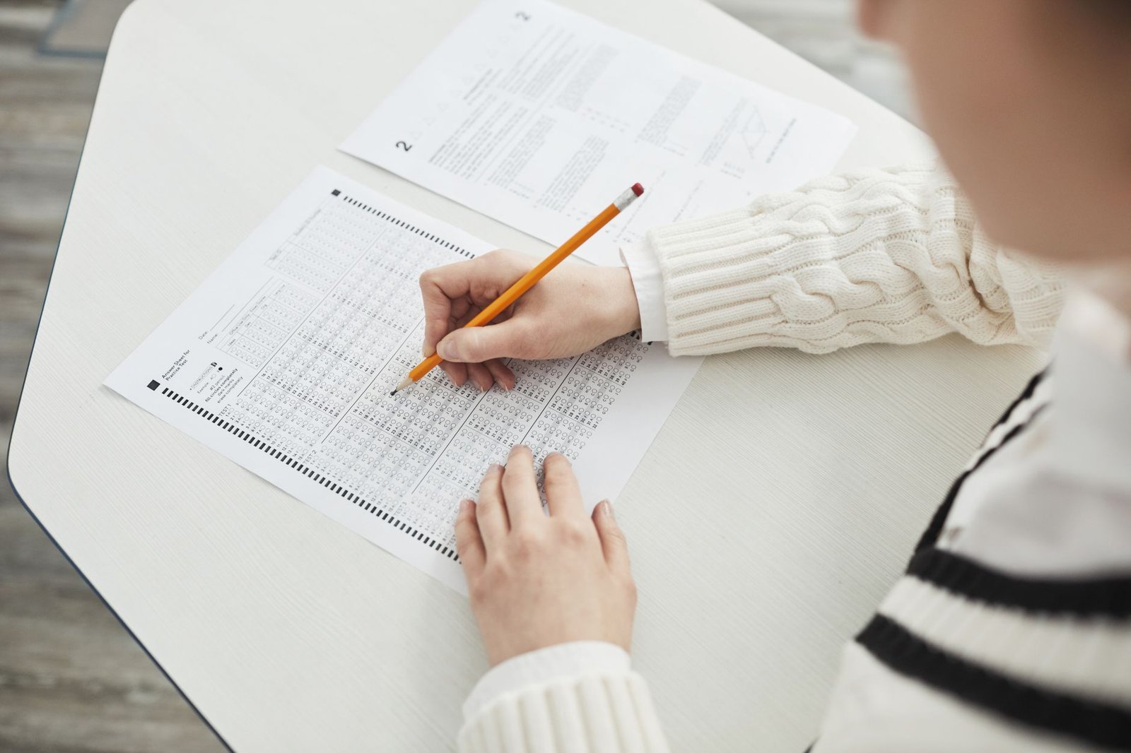 Gemini Study Notebooks: How Google's Free AI Tutor Actually Works 4 Student filling out a multiple-choice standardized test answer sheet