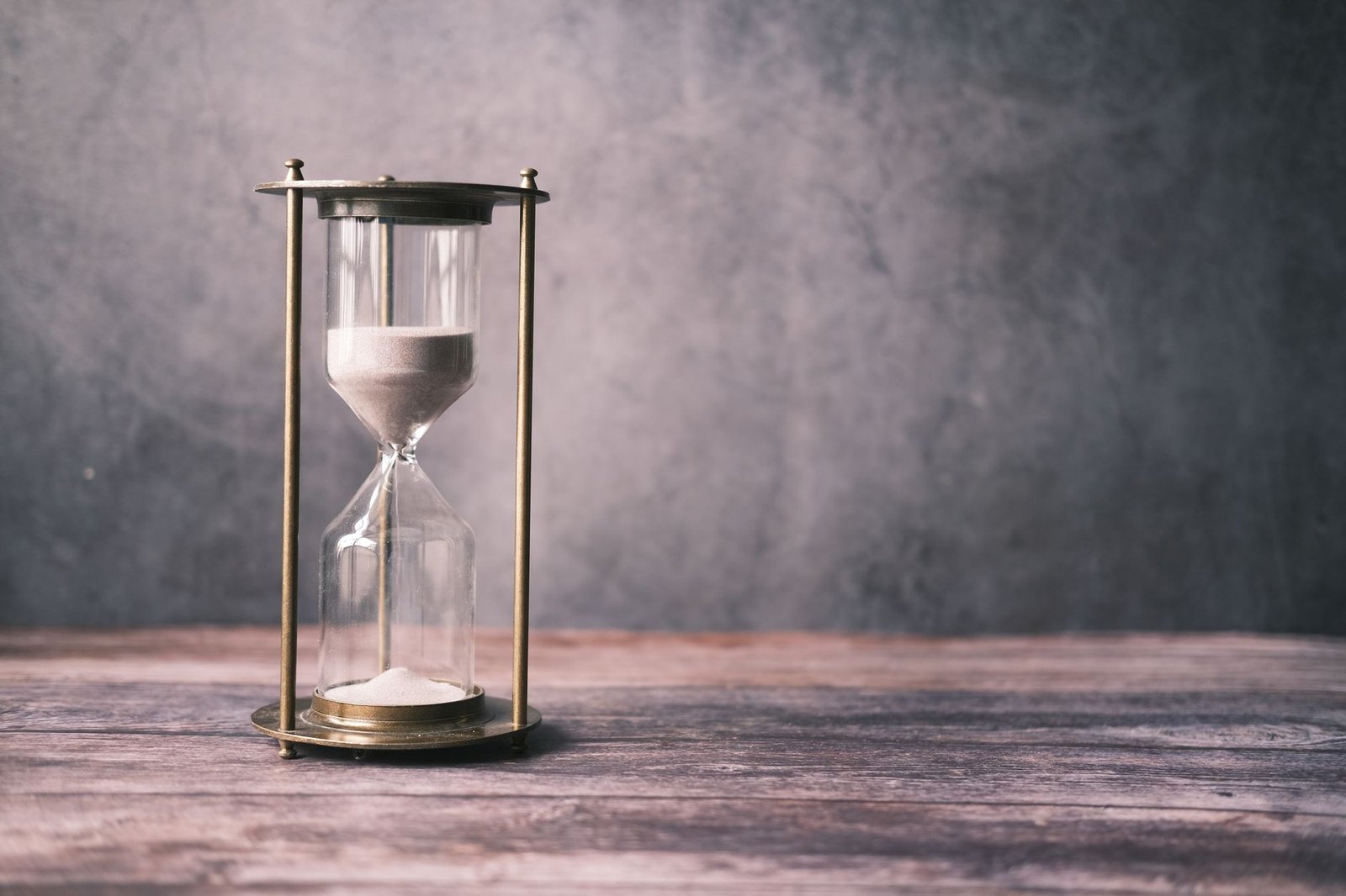 Hourglass on a desk, weighing whether to install the iOS 27 beta now or wait