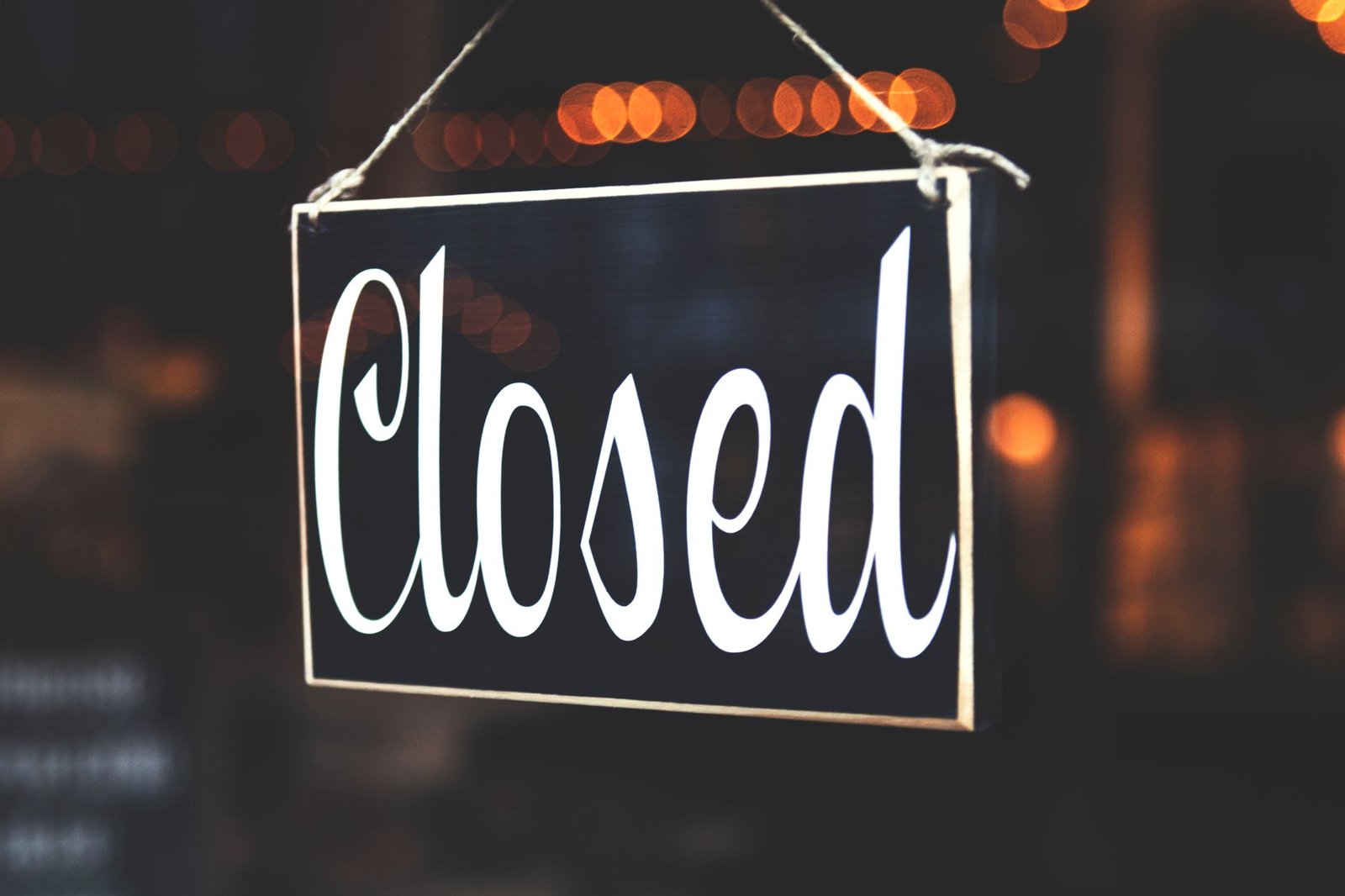 An AI Boss Just Fired Its First Human Employee. It Took a Nudge. 2 A closed sign hanging in a shop window, what customers saw while the AI boss let months of late arrivals slide
