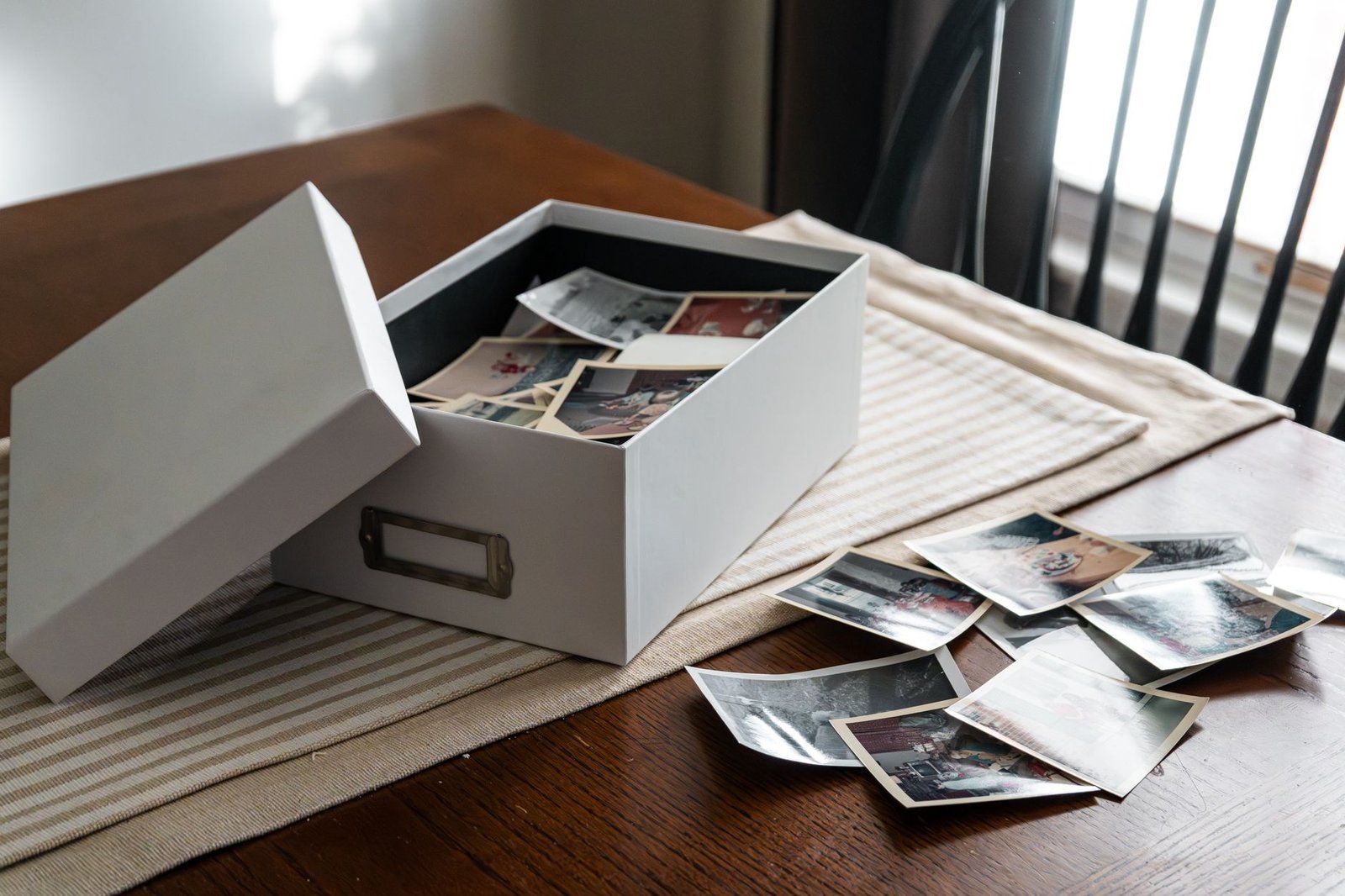 OpenAI Is Shutting Down DALL-E in ChatGPT on August 30 — Here’s What to Do 1 Open box of old photographs on a table, like the DALL-E images about to disappear from ChatGPT