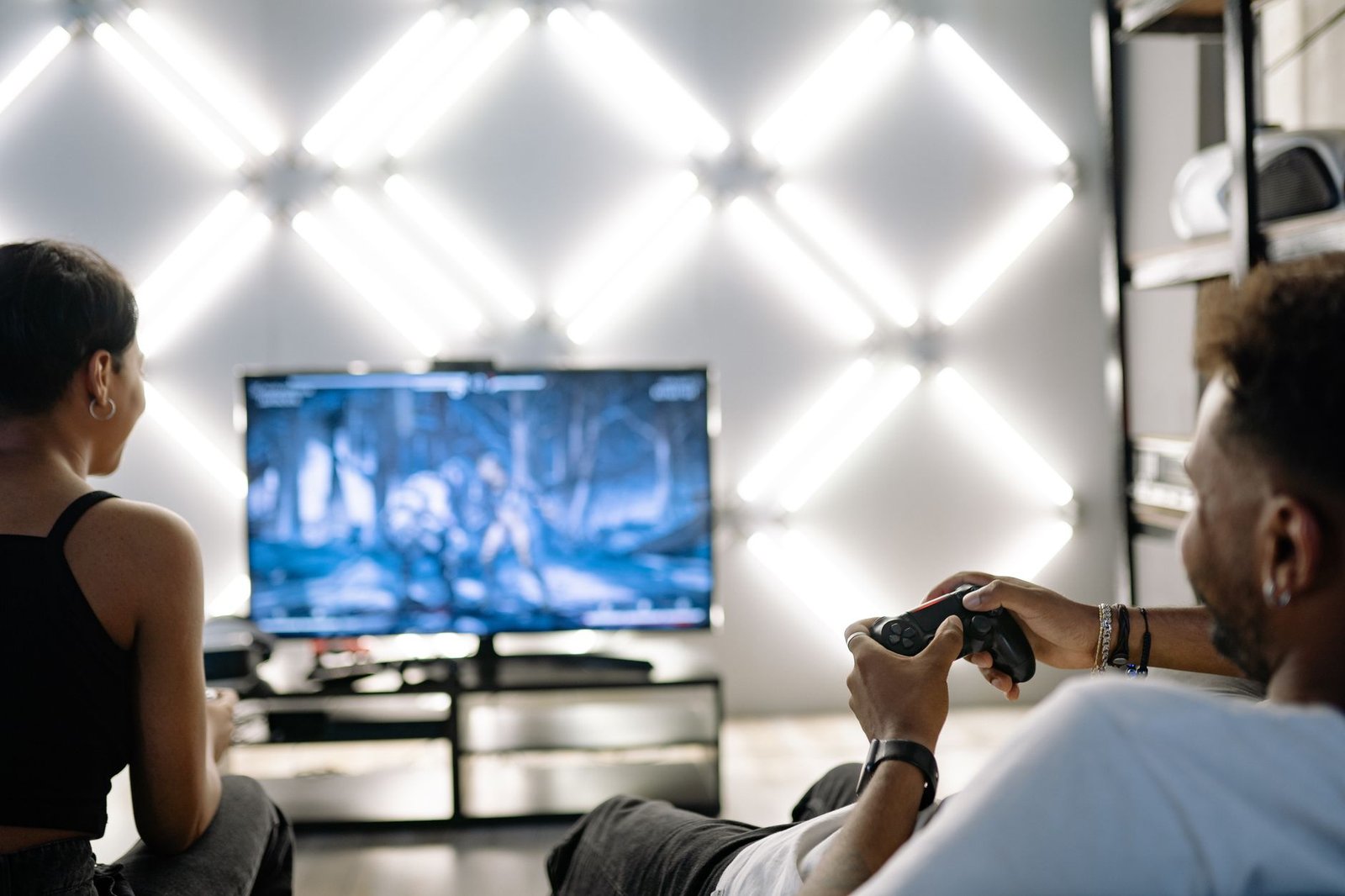 GPU Prices in 2026: AI Just Doubled the Cost of Your Next PC 4 Two people playing a game console, one of the cheaper paths while GPU prices stay high