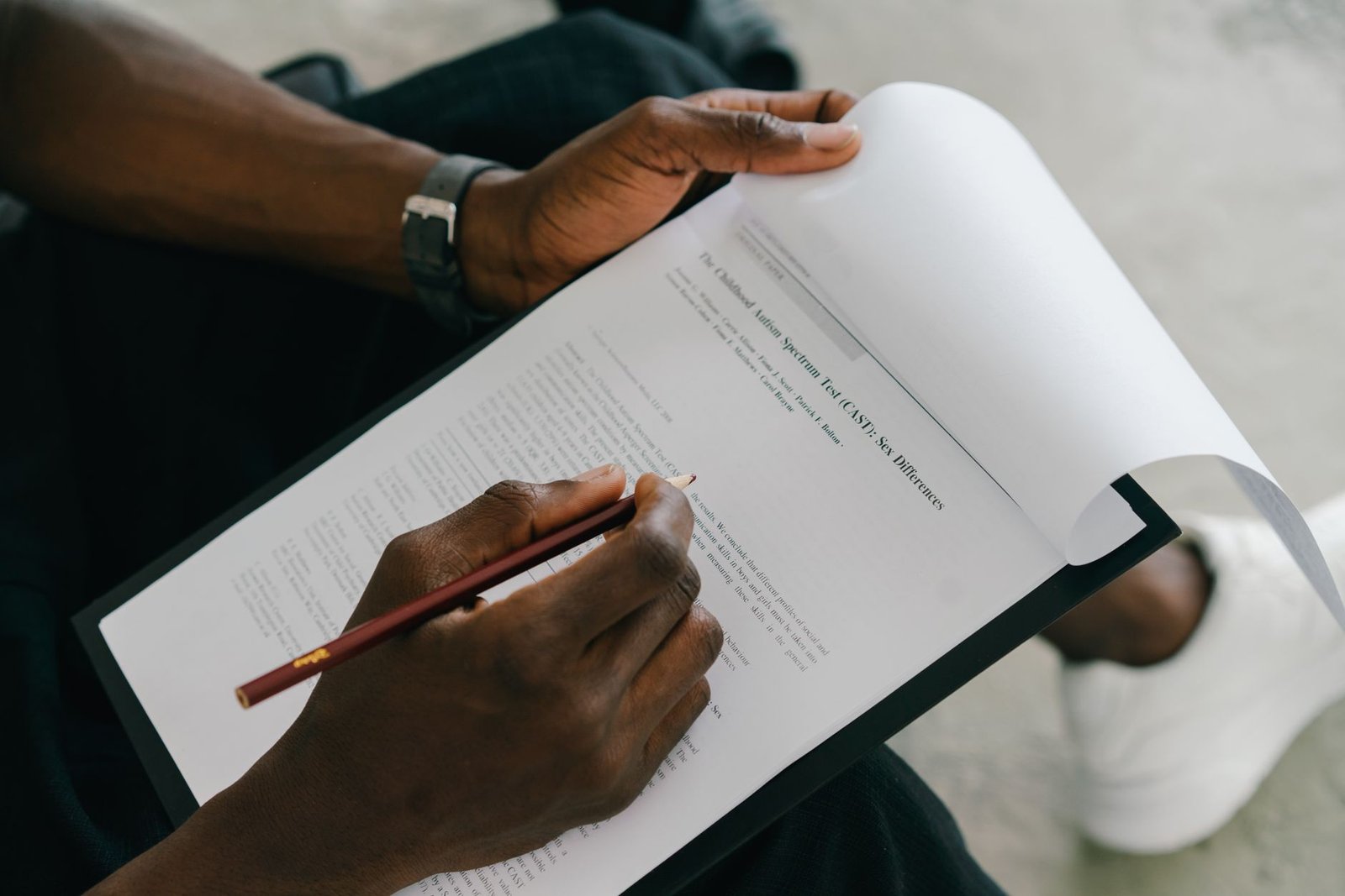 Person filling out a research questionnaire like the readers who rated AI-written stories in the Villanova study