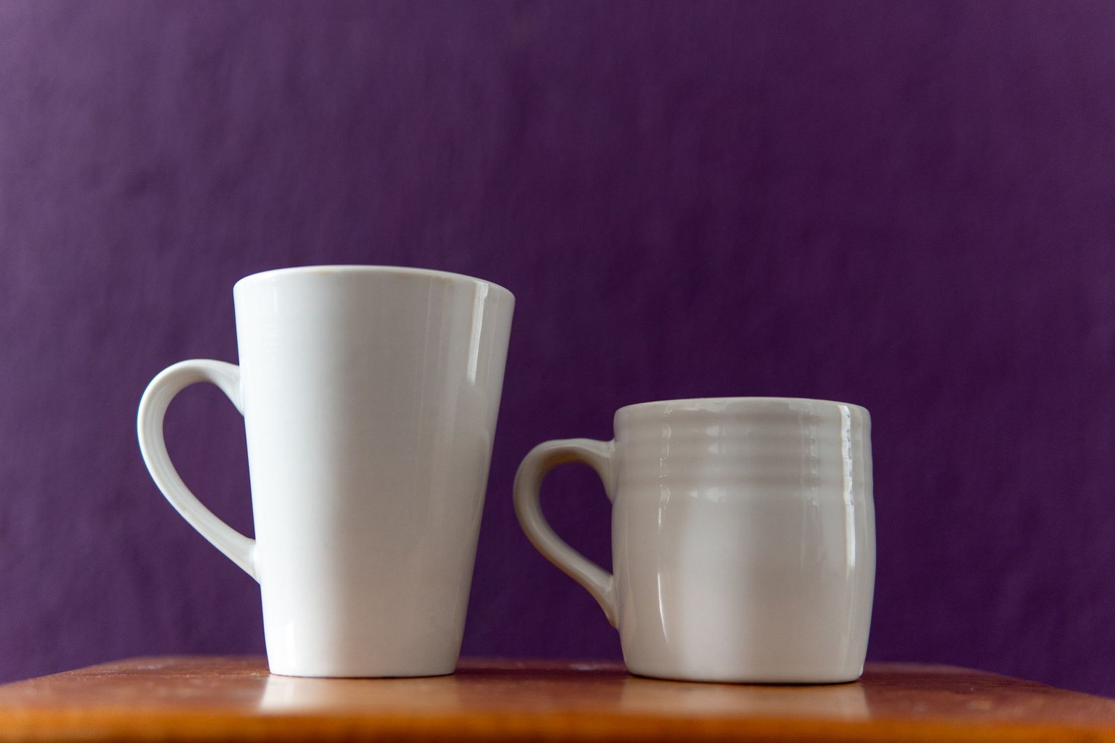Two nearly identical cups side by side, standing in for the two stories readers were asked to judge