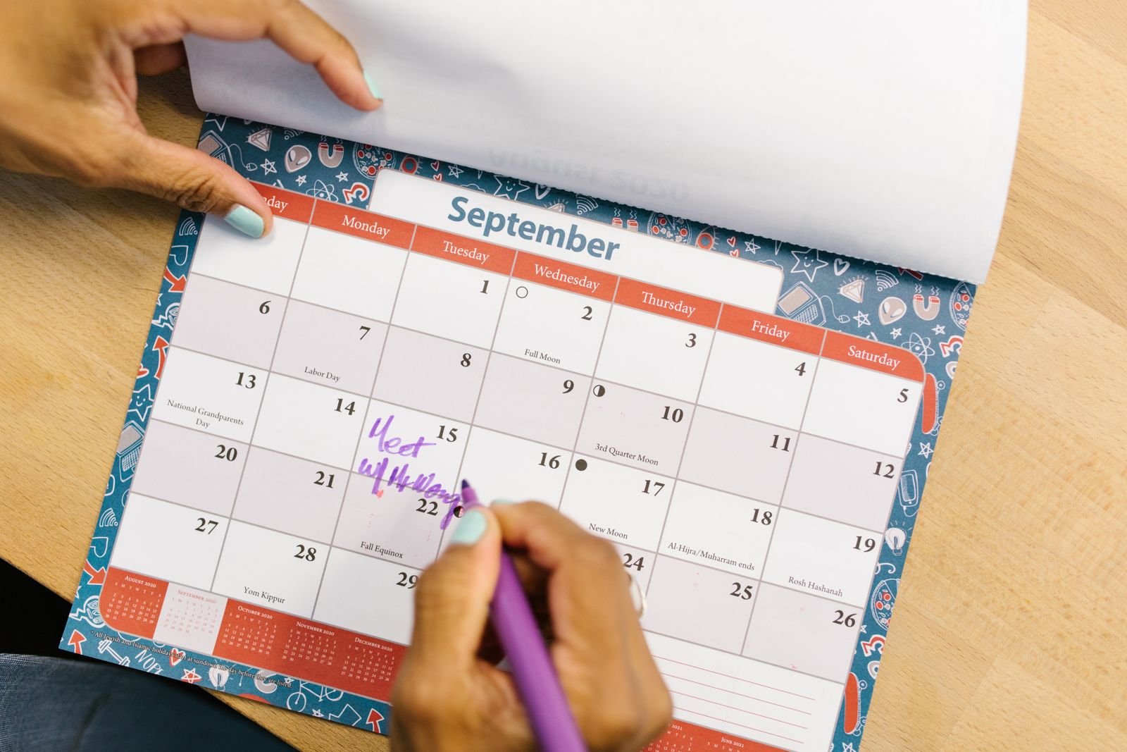 OpenAI's $500 ChatGPT Pro Max Plan Isn't for Every Month. It's for the Busy Ones. 3 A hand marking a September date on a desk calendar, one busy month picked out of the year